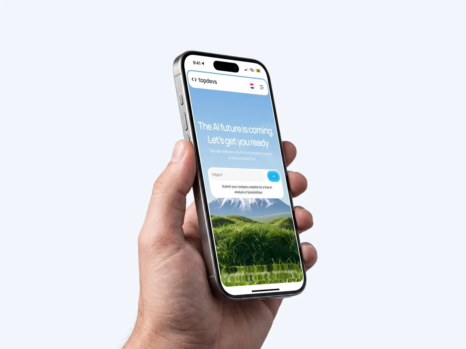 A hand holding a phone that shows the Topdevs mobile hero with the free analysis field